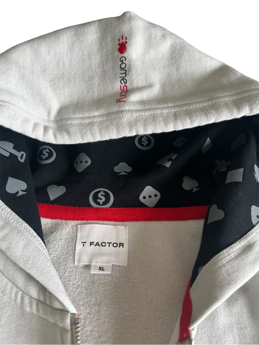 T Factor XL White Zip Hoodie with Black Printed Lining and GAMESTORY logo.